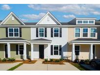 Charming multi-colored townhomes featuring black shutters and covered front porches at 237 Abercom Place Dr, Moncks Corner, SC 29461