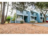 Charming two-story condo with light blue siding and a well-maintained front yard at 482 Sea Cloud Cir, Edisto Island, SC 29438