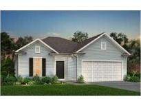 Charming one-story home featuring a garage and a meticulously manicured front yard at 116 Royal Cainhoy Way, Huger, SC 29450