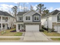 Beautiful two-story home with a stone facade and two-car garage at 1161 Triple Crown Ct, Mount Pleasant, SC 29429