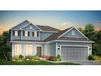 Charming two-story home with blue siding, well-manicured lawn, and a two-car garage at 118 Royal Cainhoy Way, Huger, SC 29450