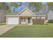 Charming single-story home with a well-manicured lawn and attached one car garage at 191 Blackstone Dr, Moncks Corner, SC 29461