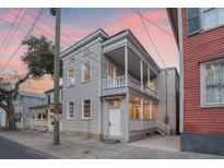 Charming two-story home featuring double porches and quaint architectural details in a historic neighborhood at 40 Pitt St, Charleston, SC 29401