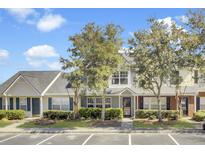 Charming townhome with well-maintained landscaping, inviting entrance, and dedicated parking spaces at 402 Pine Bluff Dr, Summerville, SC 29483