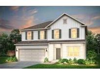Charming two-story home with white siding, a two-car garage, and an inviting entrance at 115 Royal Cainhoy Way, Huger, SC 29450