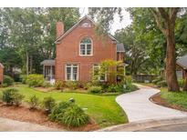 Charming two-story brick home with mature landscaping and a curved driveway at 1278 Deep Water Dr, Mount Pleasant, SC 29464