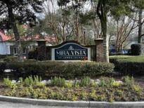Welcoming entrance sign to Mira Vista at James Island amidst lush landscaping at 1411 Telfair Way, Charleston, SC 29412