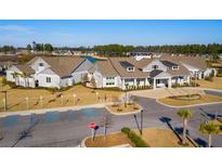 Beautiful community clubhouse with pristine landscaping and convenient accessible parking spaces at 314 Quiet Cove Trl, Summerville, SC 29486