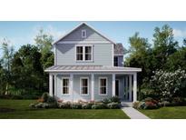 Charming two-story home featuring a welcoming front porch with classic columns and meticulously landscaped front yard at 1441 Clay Field Trl, Summerville, SC 29485