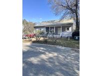 Charming single-story home featuring a covered front porch and simple landscaping at 1561 Little Rock Blvd, Charleston, SC 29412
