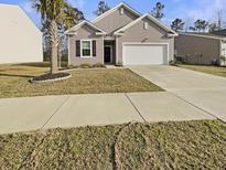 Charming single-Gathering home with tidy landscaping, a two-car garage, and a welcoming curb appeal at 307 Sedona Dr, Summerville, SC 29486