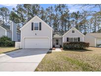 Charming single-Gathering home with a two-car garage and manicured front lawn at 4808 Hearthside Dr, Summerville, SC 29485
