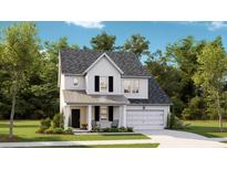 Charming two-story home with a welcoming front porch, attached garage, and nicely landscaped front yard at 1049 Tea Time Dr, Summerville, SC 29485