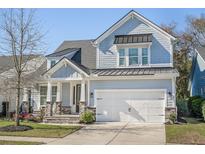 Beautiful two-story home featuring a welcoming front porch and a two-car garage at 1261 Gannett Rd, Mount Pleasant, SC 29464
