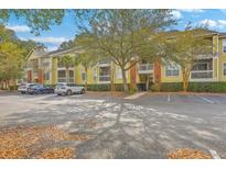 Condominium complex featuring manicured landscaping, ample parking, and a welcoming entrance at 1600 Long Grove Dr # 1621, Mount Pleasant, SC 29464