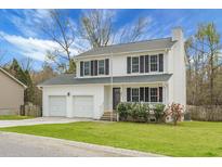Charming two-story home with well-maintained lawn, black shutters and a two-car garage at 161 Kingsbridge Dr, Goose Creek, SC 29445