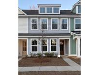 Charming townhome with light blue siding, white trim, and a well-maintained front yard at 167 Cantona Dr, Summerville, SC 29483