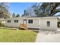 Charming single-story home with a freshly painted exterior and a well-manicured lawn at 422 Jean Wells Dr, Goose Creek, SC 29445