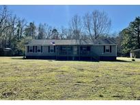 Ranch style home with covered front porch and mature trees at 8072 Bing Hill Road Rd, Adams Run, SC 29426