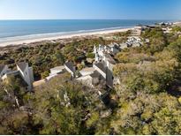 Beautiful beachside condos nestled amongst lush trees, offering stunning ocean views at 1109 Diodia Ct, Kiawah Island, SC 29455