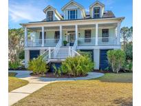 Charming two-story home with a welcoming front porch and well-maintained landscaping at 2621 Ringsted Ln, Mount Pleasant, SC 29466