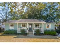 Charming single-story home featuring a covered front porch and well-maintained landscaping at 108 Rose Ln, Mount Pleasant, SC 29464