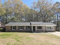 Charming brick home with a well-maintained lawn and a newly installed dark roof at 159 Foxborough Rd, Goose Creek, SC 29445