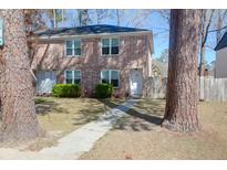 Charming brick townhouse with well-maintained landscaping and inviting front entrances at 406 Crestview Dr # D, Summerville, SC 29485