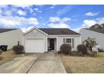 Charming single-story home with tidy landscaping, covered entry and attached one car garage at 155 Tyger St, Summerville, SC 29485