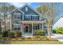 Charming two-story home with a welcoming front porch and beautifully landscaped front yard at 1908 Hall Point Rd, Mount Pleasant, SC 29466