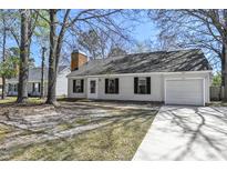 Charming single-story home featuring a garage and a well-maintained front yard and driveway at 201 Commons Way, Goose Creek, SC 29445