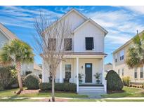 Charming two-story home with a welcoming front porch and beautifully landscaped yard at 3537 Sewel Ave, Mount Pleasant, SC 29466
