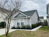 Charming single-Gathering home featuring well-maintained landscaping and a welcoming entrance at 4957 Trump St, North Charleston, SC 29420