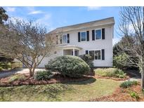 Two-story home featuring classic curb appeal and manicured landscaping at 1127 Tidal View Ln, Charleston, SC 29412