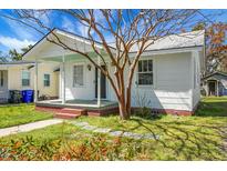 Charming single-story home with a brick foundation, a cozy front porch, and a well-maintained lawn at 2120 Thornlee Dr, North Charleston, SC 29405