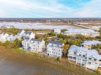 Coastal townhomes with modern design and waterfront views, creating a serene and luxurious living environment at 2135 Tides End Rd, Charleston, SC 29412