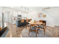 Modern kitchen featuring a large island, granite countertops, pendant lighting, and stainless steel appliances at 286 Godwit Dr, Summerville, SC 29486