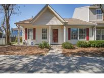Charming home featuring red shutters, a well-manicured yard, and a welcoming front entrance at 507 Tayrn Dr, Charleston, SC 29492