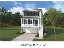 Charming two-story home with a welcoming front porch and a two-car garage at 712 Minton Rd, James Island, SC 29412