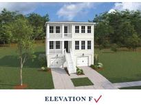 Charming new two-story home with a double garage, inviting porch, and manicured lawn at 714 Minton Rd, Charleston, SC 29412