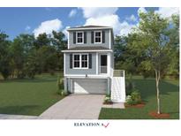 Charming three-story home with a ground-level garage and welcoming front porch at 724 Minton Rd, Charleston, SC 29412