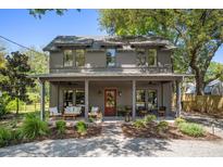Charming two-story home featuring a welcoming front porch and meticulously landscaped front yard at 750 Atlantic St, Mount Pleasant, SC 29464