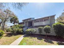 Charming condo exterior with a well-maintained lawn and landscaped greenery creating a welcoming ambiance at 1158 Village Creek Ln # 3, Mount Pleasant, SC 29464