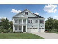 Two-story home with light blue siding and a two-car garage, and columns on the front porch at 2022 Riverbend Dr, Charleston, SC 29412