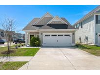 Charming single-Gathering home featuring a two-car garage and well-maintained landscaping at 546 Alderly Dr, Moncks Corner, SC 29461