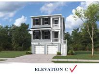 Charming two-story home with a double garage, well-manicured lawn, and inviting curb appeal at 740 Minton Rd, Charleston, SC 29412