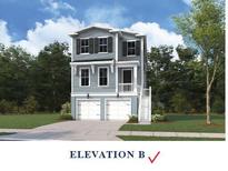 Charming two-story home featuring a two-car garage, neutral siding, and a welcoming front entrance at 744 Minton Rd, Charleston, SC 29412