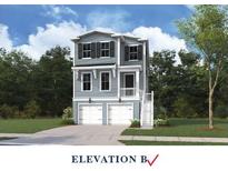Charming two-story home with light blue siding, black shutters, and a two-car garage at 750 Minton Rd, Charleston, SC 29412