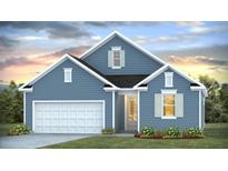 Charming blue house featuring a well-maintained lawn, white garage door, and beautiful landscaping at 2196 Macallan Blvd, Ravenel, SC 29470