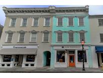 Charming multi-story building with unique architecture and vibrant colors in downtown area at 338 King St # B, Charleston, SC 29401